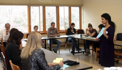 Radhika Plakkot (standing), 2008 Calvert County Teacher of the Year and the 2010 Maryland Science Teacher of the Year, gives a lesson during the teacher forum at St. Mary’s College of Maryland that brought educators together from all over Southern Maryland. (Submitted photo)