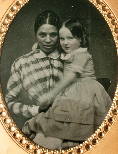 Martha Ann "Patty" Atavis holds Alice Lee Whitridge, one of the children in her care. The Maryland Historical Society recently acquired the rare photograph and documents that shed light on Atavis' life as a pre-Civil War domestic slave in Baltimore. Historians plan to use the new information to learn more about urban slavery in Baltimore and around the country. (Photo: Jessica Talson)