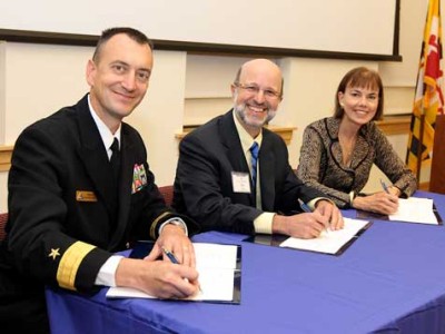 Rear Admiral Randy Mahr, Commander, Naval Air Warfare Center Aircraft Division; Joseph Urgo, St. Mary’s College president; and Bonnie Green, executive director, The Patuxent Partnership, at signing ceremony on October 18. (Photo: Darren Farrell)