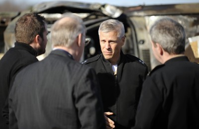 Rear Adm. Matthew Klunder, chief of naval research, talks with Dr. Clifford Bedford, Office of Naval Research's (ONR) energy conversion program officer, Capt. Michael Smith, right, commanding officer Naval Surface Warfare Center (NSWC) Dahlgren Division, and Jeb Brough, left, NSWC reactive materials lead, following an ONR High-Density Reactive Material (HDRM) demonstration held at NSWC Dahlgren's Pumpkin Neck test facility. HDRM has the strength of common aluminum alloys yet the density of mild steel, making it an ideal replacement for steel components in existing weapon systems. (U.S. Navy photo by John F. Williams/Released)