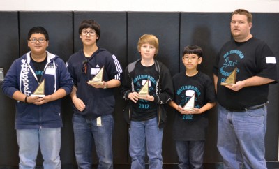 Mattawoman Middle School from Charles County won first place in the team competition of the MATHCOUNTS event. From left are Justin Arter, James Arter, Logan Carter, Thach-Vu Nguyen, and coach Sean Lloyd. Logan Carter also placed first in the countdown round of the event, as well as in the sprint and target rounds.