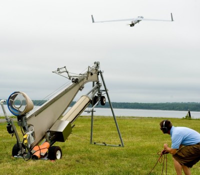 A Naval Surface Warfare Center Dahlgren Division engineer launches the Insitu Scan Eagle unmanned aerial vehicle during a demonstration at the Potomac River Test Range for Coast Guard and Navy leaders on May 3, 2012. The Scan Eagle UAV is scheduled to deploy aboard a Coast Guard National Security Cutter this summer. U.S. Coast Guard Photo by Public Affairs Specialist 1st Class Andy Kendrick (Released)