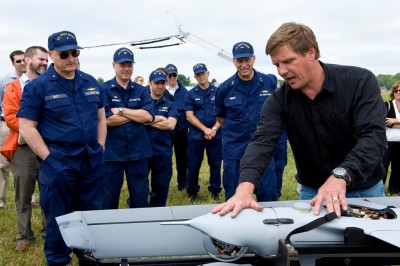 Naval Surface Warfare Center Dahlgren Division engineer Lorenz Eber briefs the design and capabilities of the Insitu Scan Eagle - a small unmanned aerial vehicle - to U.S. Coast Guard leaders at the Potomac River Test Range in Dahlgren, Va., May 3, 2012. Eber spoke with the USCG Assistant Commandant for Capability, the USCG Assistant Commandant for Engineering and Logistics, and the USCG Commanding Officer of the Research and Development Center after demonstrating the Scan Eagle UAV in flight. It's scheduled to deploy aboard a Coast Guard National Security Cutter this summer. U.S. Coast Guard Photo by Public Affairs Specialist 1st Class Andy Kendrick (Released)