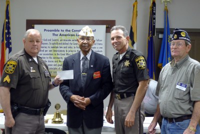 Pictured from left to right are Sgt. Carl Rye, Robert Johnson, Sheriff Rex Coffey and Buddy Hindle.