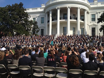 President Obama takes the stage to speak to hundreds of Olympic athletes on the South Lawn of the White House. (Photo by Chris Leyden)