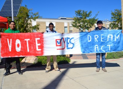 (From left to right) Montgomery College students, Yves Gomes, 20, Julio Castillo, 19, and Raymond Jose, 22, campaign for the Dream Act at the school's Rockville campus. (Photo: Sophie Petit)