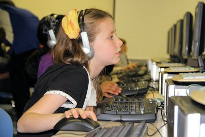 Autumn Clay, a fourth grader at Mt. Hope/Nanjemoy Elementary School, concentrates on coding during participation in the Hour of Code.