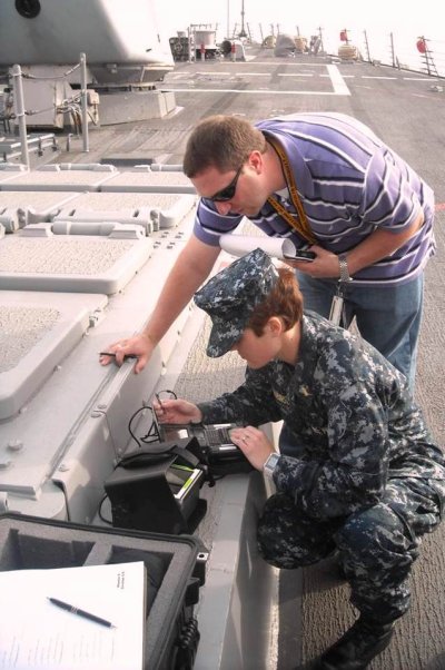 Justin Kingsford, Naval Surface Warfare Center Dahlgren Division (NSWCDD) Human Systems Engineer, works with a Navy officer to conduct usability testing on the AN/PYX-1 Identity Dominance System aboard USS Oscar Austin (DDG-79) in Norfolk, Va. The system collects biometrics such as face, finger, and iris images, and enrolls that information into a local database to match against known persons of interest. Once the information has been captured, the system sends the information back to the authoritative data base. Kingsford, NSWCDD HSI Deputy Program Director, and his team support a wide range of science and technology initiatives that include human interaction devices and interfaces, 3D gestural controls, adaptive projection augmented models, unmanned systems, and next generation weapons integration.