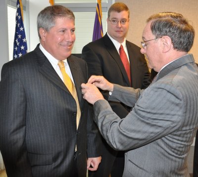 DAHLGREN, Va. - Joint Program Executive Officer for Chemical and Biological Defense Carmen Spencer, right, pins the Army Commander's Award for Civilian Service Medal on Mike Pompeii in recognition of his leadership in the successful installation of collective protection on the MV Cape Ray for the Syrian chemical weapons neutralization mission. (U.S. Navy photo by John Joyce/Released)