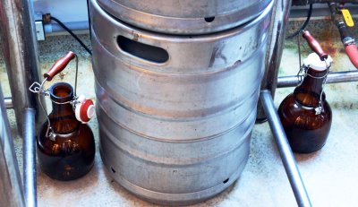 Two growlers surrounding a keg, which current law allows brewpubs to refill and sell for consumption off their premises, in the Ruddy Duck Brewery and Grill in Dowell. (Photo: Sarah Tincher)