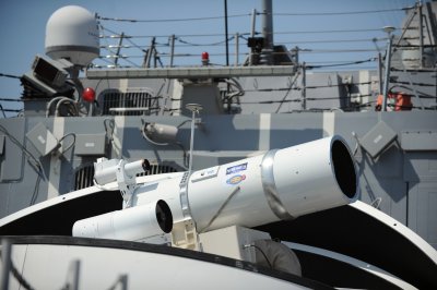 The Laser Weapon System (LaWS) temporarily installed aboard the guided-missile destroyer USS Dewey (DDG 105) in San Diego, Calif., is a technology demonstrator built by the Naval Sea Systems Command from commercial fiber solid state lasers, utilizing combination methods developed at the Naval Research Laboratory. LaWS can be directed onto targets from the radar track obtained from a MK 15 Phalanx Close-In Weapon system or other targeting source. The Office of Naval Research's Solid State Laser (SSL) portfolio includes LaWS development and upgrades providing a quick reaction capability for the fleet with an affordable SSL weapon prototype. This capability provides Navy ships a method for Sailors to easily defeat small boat threats and aerial targets without using bullets. (U.S. Navy photo by John F. Williams/Released)