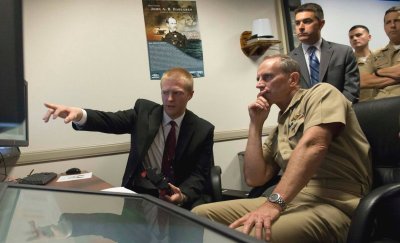 DAHLGREN, Va. (Sept. 4, 2014) - Chief of Naval Operations (CNO) Adm. Jonathan Greenert observes a live-fire demonstration of the Laser Weapons System (LaWS) at the Naval Surface Warfare Center Dahlgren Division where he was also briefed and shown demonstrations of the Electromagnetic Railgun and Real-Time Spectrum Operations. During his visit, Greenert also held an all-hands call with Naval Support Facility South Potomac Sailors, civilians and family members to discuss the current and future status of the Navy. (U.S. Navy photo by Chief Mass Communication Specialist Peter D. Lawlor/Released)