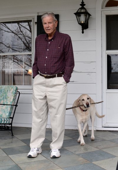 Gov. Harry Hughes and his Labrador retriever, Miller, look out on the Choptank River. Miller loves to play fetch with his sticks. (Photo: Max Bennett)