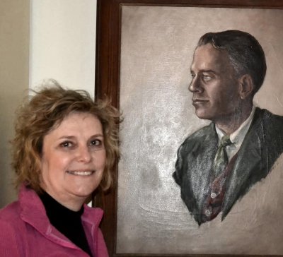 Alexa Fraser remembers her father as "a joy of life," like in the youthful portrait of him in her Rockville home. At 90, he killed himself after suffering from Parkinson's disease. This has sparked Fraser to advocate for the right to physician-assisted "death with dignity" in Maryland. (Photo: Grace Toohey)