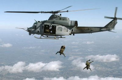 QUANTICO, Va. - Brenden McMullen (closest to helicopter) jumps out of the Marine Corps UH1Y over Marine Corps Base Quantico while assigned to Marine Corps Systems Command as a Navy Senior Chief Special Amphibious Reconnaissance Corpsman in 2006. McMullen - now a Navy civilian engineer - was recently commended for his impact on new research to identify threats, risks, and vulnerabilities related to wearable and embeddable technologies. As the only Department of Defense civilian member of a Department of Homeland Security focus group, he used his military expertise to evaluate wearable items like fitness bands and medical telemetry - including LifeAlert and GoogleGlass - in addition to surgically implanted items. "This year's program would not have been a success without Brenden's active engagement and partnership," said a DHS official in a December 2014 letter to the Navy. (U.S. Marine Corps Photo/Released)