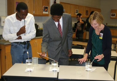 North Point High School seniors Njuguna Thande, left, and Christain Barnes, center, participate in a hands-on lesson with engineer teacher Cheryl Swartzwelder earlier this school year. Thande and Barnes were recently named finalists in the National Achievement Scholarship Program.