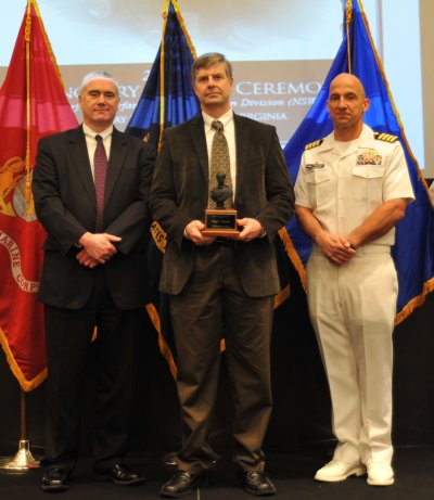 Dr. Orgal Thomas Holland received the John Adolphus Dahlgren Award for his technical excellence in implementing modeling and simulation to enhance naval warfighting capabilities.