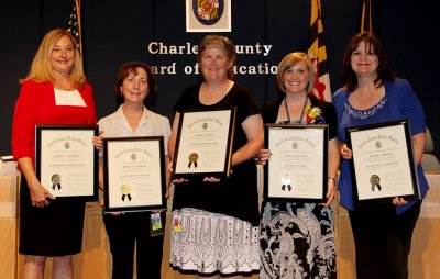 The Board of Education honors several employees at their monthly meetings for their accomplishments in the classroom, school and with students and staff. During the May 12 meeting, five exemplary employees were recognized by the Board. Pictured from left is Connie Mattingly, instructional resource teacher at Walter J. Mitchell Elementary School, Debra Van Roon, language arts teacher at Mattawoman Middle School, Pamela Jones, culinary arts teacher at North Point High School, Julie Colaizzi, science teacher at Mary B. Neal Elementary School, and Joanne Brown, occupational therapist and special education teacher at the F.B. Gwynn Educational Center.