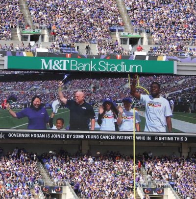 Gov. Larry Hogan with daughter Jaymie and cancer patients greet crowd at Ravens game Sunday. Photo from his Facebook page.