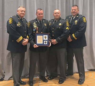 From left: Sheriff Mike Evans, Dfc. Mark Robshaw, Cpl. Jason Dean, and Capt. Todd Ireland.