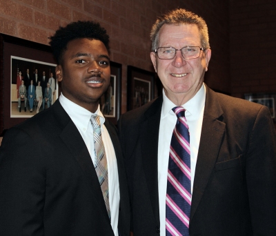 Pearson Benson, left, a Westlake High School junior and Student Member to the Board of Education, talks with Maryland Sen. Thomas “Mac” Middleton, right, at a legislative breakfast hosted by the Board of Education on Dec. 1. The Board met with several members of the Southern Maryland delegation to talk about topics such as testing and teacher retention.