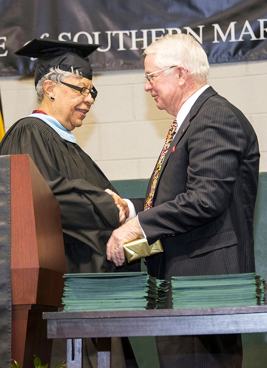 CSM Board of Trustees Chair Dorothea Smith, left, presents the 2016 Distinguished Service Award to Joe Shannon for his exemplary and extended service to the college. (Photo: CSM)