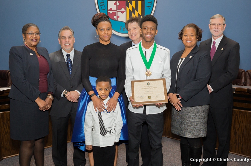 Charles County Commissioners with Keymar Green (third from right), joined by his brother and mother. (Photo: Charles Co. Government)