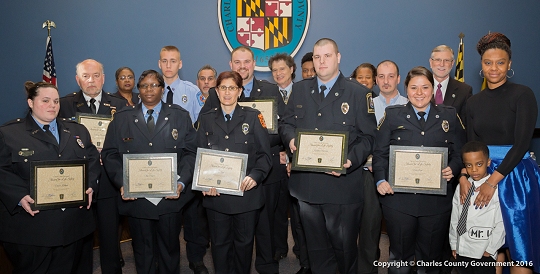 Charles County Commissioners with Charles County Emergency Services' emergency personnel, Waldorf Volunteer Fire Department personnel, Keymar Green, and Green's family. (Photo: Charles Co. Government)