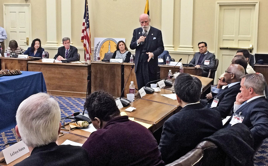 Maryland Attorney General Brian Frosh, left of the American flag, and state Sen. Susan Lee, D-Montgomery, left of Frosh, listen to Vinton Cerf, vice president of Google and keynote speaker at this year's first meeting of the Maryland Cybersecurity Council on Thursday, February 4, 2016. (Photo: Leo Traub)