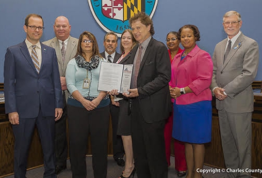 Pictured left to right: Christopher Strong, National Weather Service; William Stephens and Jennifer Adams, Charles County Department of Emergency Services; Commissioner Bobby Rucci (District 4); Michelle Lilly, Charles County Department of Emergency Services; Ken Robinson (District 1); Commissioner Vice President Debra M. Davis, Esq. (District2); Commissioner Amanda M. Stewart, M.Ed. (District 3); and President Peter F. Murphy.