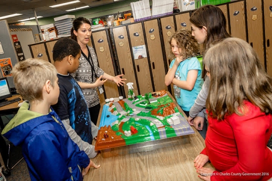 Erica Hahn, Charles County Government, with Dr. James Craik Elementary School students. Not pictured: Commissioner Ken Robinson (District 1) and Megan Donnick, Charles County Government. (Photo courtesy Charles Co. Gov.)