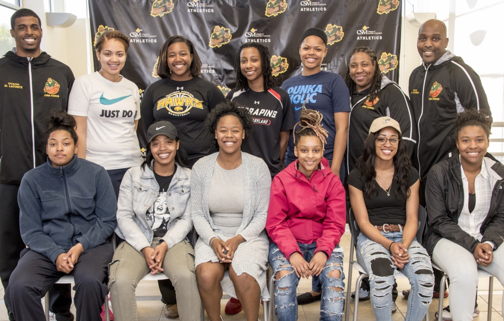 New and returning women's basketball players and coaches who participated in a signing ceremony were, front from left, freshman Haley Oliver of Waldorf, sophomore Saundra "Sinai" Downs of La Plata, and freshmen Paris Ferguson of Great Mills, Doretha Curry of Clinton, Tamara Burns of Fairfax and Gabby Coley of Frederickburg; and back row from left, Assistant Coach Marcus LeCounte, freshman Brittany Coles of Waldorf, sophomores Akilah Stroman of White Plains and Kiona Montgomery of White Plains, freshman Erica Silver of Riverdale, Assistant Coach Kim Barnes and Head Coach Ardell Jackson.