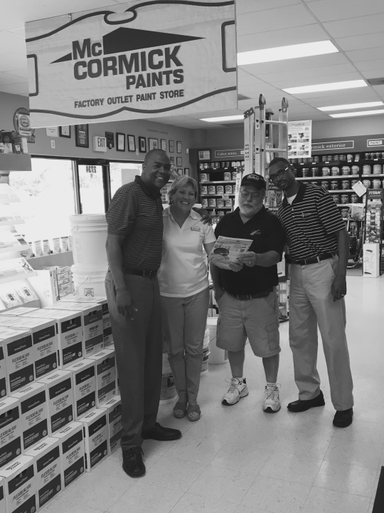 Avalon Building Supply owner Mary Bohanan and McCormick Paint representatives at the McCormick Paint store in Waldorf.