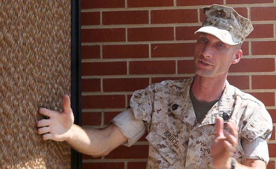 Staff Sgt. Mark Bruce, engineer chief with Chemical Biological Incident Response Force explains how a portable cooler uses large coils soaked in water and a fan to provide cooling at the local chow hall aboard Naval Support Facility Indian Head, Maryland, July 22, 2016. The event provided the Marines with the engineer platoon hands-on training further sharpening their skills for expeditionary operations. (USMC photo)