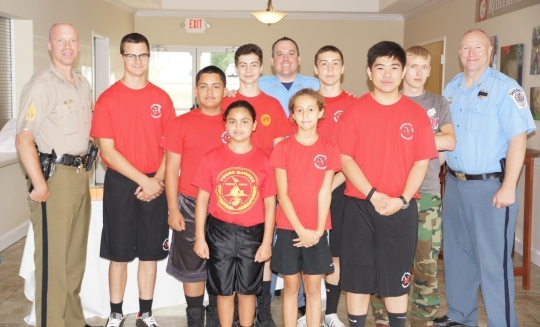 First Sergeant John Vanhoy, Captain Daniel Alioto, and Captain Steven Hall meet with the Southern Maryland Young Marines Unit.