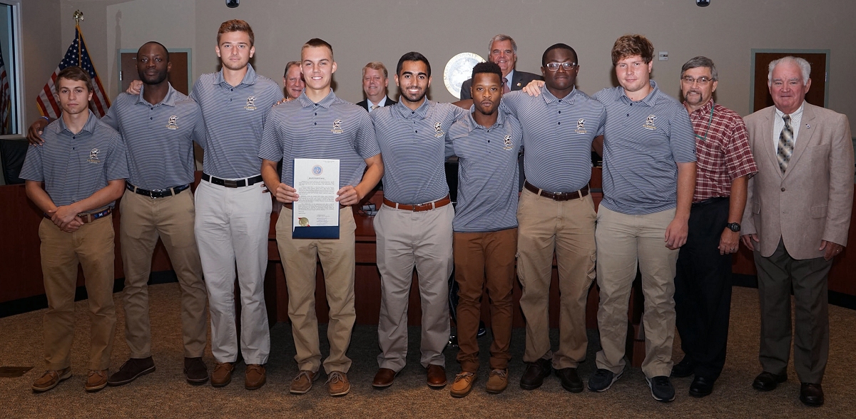 (Back row L-R) Commissioner Mike Hewitt, Commissioner Tom Jarboe, Commissioner Todd Morgan. (Front row L-R) Kyle Moore (Mt. Airy, Md.), Ivan Messi (Damascus, Md.), Sam Baker (Glen Burnie, Md.), Andrew Marinich (Bel Air, Md.), Ali Biglarbeigi (Olney, Md.), Alhaj Khadar (Brentwood, Md.), Rick Djeuhon (Silver Spring, Md.), Matt Carr (New Market, Md.), Coach Larry Donmoyer and Commissioner James Randy Guy. Missing for the photo from the official 12 man playing roster for the NSCRO Championship: Graduating seniors Kyle Powers (Towson, Md.) and Sam Howe (Frederick, MD); Returning players missing Will Hankins (Annapolis, Md.) and Tom Cullen (Kensington, Md.); and Assistant Coach Terry Pledger. (Photo courtesy of SMCM)