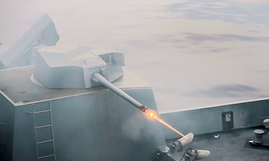 EAST CHINA SEA—The amphibious transport dock ship USS Green Bay (LPD 20) fires a MK-46 30mm gun during a live-fire exercise. Navy scientists and engineers evaluated a strike group's Aegis combat system and gun weapon systems - including the 30 millimeter gun - as well as unmanned vehicles integrated with surface and air assets at the 2016 USS Dahlgren demonstration, Aug. 30. The test - made possible by a cybernetic laboratory called USS Dahlgren - proved engagement coordination across the simulated battlegroup and live fire destruction of multiple targets from two combatants utilizing two different gun based systems. 