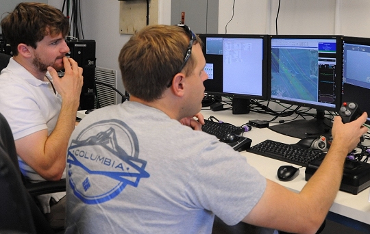 DAHLGREN, Va.—Navy Scan Eagle unmanned aerial vehicle operators Robert Briggs and Scott Heyman conduct launch and recovery efforts via Scan Eagle at the 2016 USS Dahlgren demonstration, Aug. 30. The Scan Eagle was part of the Navy's evaluation of a strike group's gun weapon systems, combat systems, and unmanned vehicles integrated with surface and air assets at the 2016 USS Dahlgren demonstration. The test - made possible by a cybernetic laboratory called USS Dahlgren - proved engagement coordination across the battlegroup and live fire destruction of multiple targets from two combatants utilizing two different gun based systems. (U.S. Navy photo by Patrick Dunn/Released)
