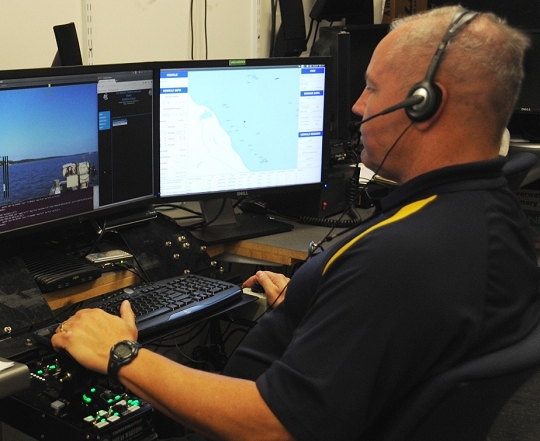 DAHLGREN, Va.—Eugene Rivers, a Navy unmanned surface vessel (USV) operator, conducts over-the-horizon contact detection and tracking in addition to battle damage assessment following engagement at the 2016 USS Dahlgren demonstration, Aug. 30. The USV was part of the Navy's evaluation of a strike group's gun weapon systems, combat systems, and unmanned vehicles integrated with surface and air assets. The virtual USS Dahlgren proved engagement coordination across the battlegroup and live fire destruction of multiple targets from two combatants utilizing two different gun based systems. (U.S. Navy photo by George Smith/Released)