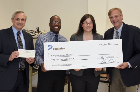 The College of Southern Maryland Foundation received a $45,000 Higher Educational Partnership Grant from the Dominion Foundation to upgrade equipment in CSM's electronics laboratories that CSM hopes will help the college attract more students into its engineering, engineering technology, nuclear engineering technology and computer science programs. From left are Dr. Brad Gottfried, CSM president; Dr. Tracy Harris, vice president and dean of CSM's Leonardtown Campus; Bernice Brezina, interim chair of CSM's Business and Technology Division; and Mike Frederick, vice president of LNG operations at Dominion Cove Point LNG.