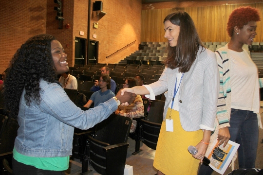 CRD Handshake: Rebecca Pearson, career and technology education specialist for CCPS, right, demonstrates the power of a firm handshake with Westlake High School junior Markayla Conner. Pearson shared with students tips on proper business etiquette at the school system's kickoff Tuesday for the Career and Research Development (CRD) program. The program provides enrolled juniors and seniors with work-based learning experiences.