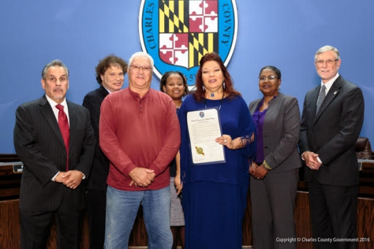 Pictured (left to right): Commissioner Bobby Rucci (District 4); Commissioner Ken Robinson (District 1); Francis Penny, Piscataway Conoy Tribe; Commissioner Amanda M. Stewart, M.Ed. (District 3); Dianna Penny, Piscataway Conoy Tribe; Commissioner Vice President Debra M. Davis, Esq. (District 2); and Commissioner President Peter F. Murphy.