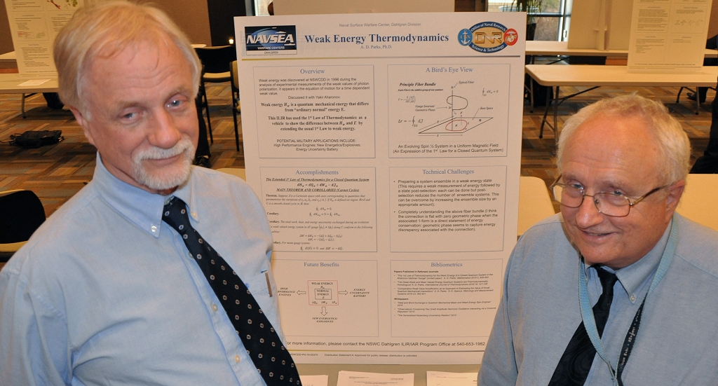 Navy scientists Dr. Dan Parks, left, and Dr. Jeffrey Solka are pictured with a poster explaining weak energy thermodynamics that Parks presented at a November 2016 poster session featuring Naval Surface Warfare Center Dahlgren Division (NSWCDD) In-house Laboratory Independent Research (ILIR) projects. Solka, the NSWCDD ILIR and Independent Applied Research Program Director, presented Parks with the command's ILIR Excellence Award for his research over the course of ten years on weak energy and its properties at the event. Potential military applications of weak energy includes new energetics and explosives as well as significant impact to high performance engines and the storage of power for warfighters deployed to dangerous and remote regions. (U.S. Navy photo/Released)