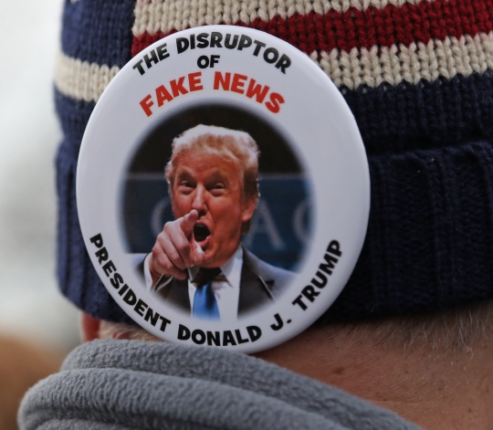 Many attendees wore Trump memorabilia relating to his presidential campaign, including pins that read "Revenge of the Deplorables" and this pin about Trump's attitude towards the news media. (Photo: Hannah Klarner)
