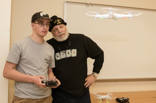 Noah Zwick, left, and Jeff Seehase work on their flying skills during the Introduction to Small Unmanned Aircraft System (sUAS) course (AVN-5000) at the La Plata Campus. (Photo: CSM)