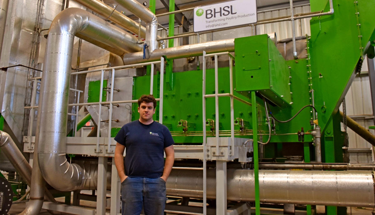 BHSL project engineer James O'Sullivan stands in front of the fluidized bed combustion unit at Double Trouble Farms in this Jan. 27, 2017, photograph. The company runs eight similar units in the United Kingdom. (Photo: Jack Chavez)