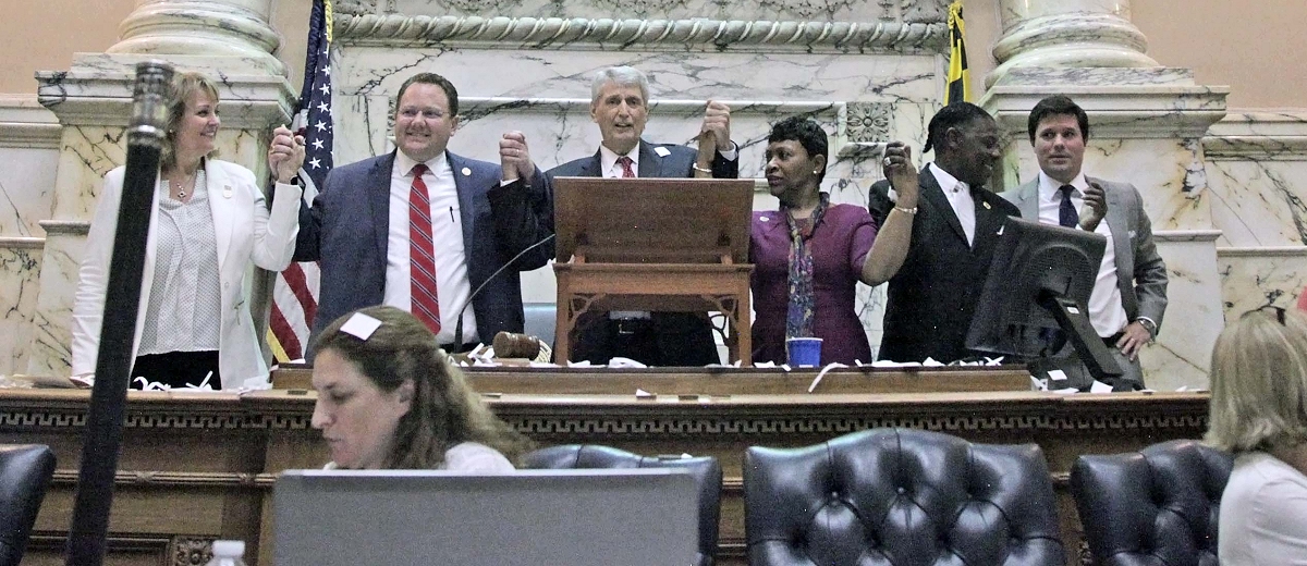 Members of the Maryland House of Delegates stand holding hands in celebration of the end of the legislative session in Annapolis, Md., on April 10, 2017.  Session ended at midnight, and was the last opportunity for legislators to pass bills presented during the General Assembly. (Photo: Hannah Klarner)