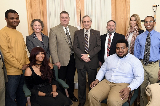 CSM digital production students, seated, from left, Destiny Posso of Waldorf and Charles Thompson of Bryans Road and, standing far left, Tionte Smiley of Brandywine and, far right, Alfonzo Thomas of Prince Frederick were awarded for their efforts in producing public service announcements on theft prevention. Participating in the ceremony were, second from left in back, CSM Vice President of Academic Affairs Dr. Eileen Abel, Executive Director of the Maryland Vehicle Theft Prevention Council Chris McDonald, CSM President Dr. Bradley Gottfried, Maryland/DC Anti-Car Theft Committee President Paul Holland and Maryland State Police Deputy Director of Media Communications Elena Wendell-Russo.