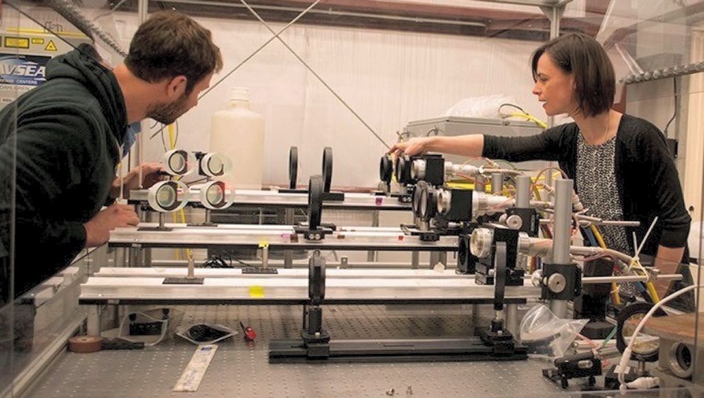 DAHLGREN, Va. - Naval Surface Warfare Center Dahlgren Division (NSWCDD) scientists Chris Von Hohenleiten and Emily Martin prepare for a laser lethality test by ensuring the optics are aligned correctly. The laser experts aligned the optics in the Navy's Laser Lethality and Development Laboratory which features an above-ground tunnel used for evaluating high energy laser weapon systems. The tunnel - crucial to gun range operations during World War II - was recently transformed into a vital new capability for testing laser technologies, NSWCDD officials announced April 21.