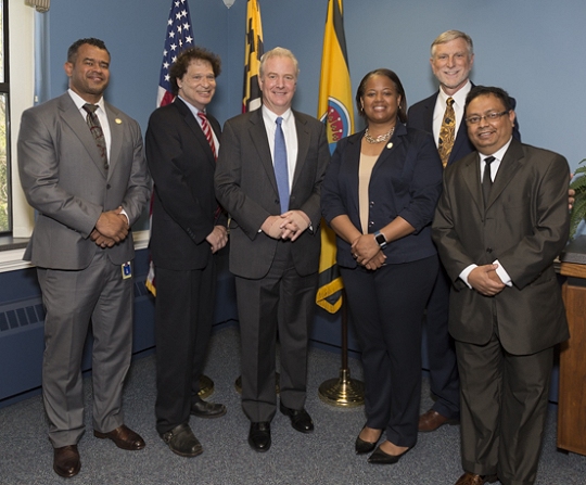 (left to right): Delegate C.T. Wilson; Commissioner Ken Robinson (District 1); Senator Chris Van Hollen; Commissioner Vice President Amanda M. Stewart, M.Ed. (District 3); Commissioner President Peter F. Murphy; and Town of Indian Head Vice Mayor Ron Sitoula.